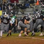 Damian Lambert (#25) hands off to Ian Brooks (#33)